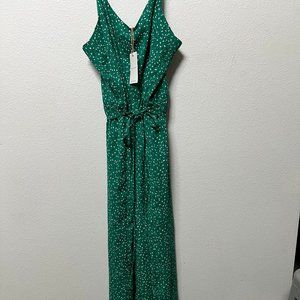 Lightweight Jumpsuit with tie at the waist, and smocking in the back.